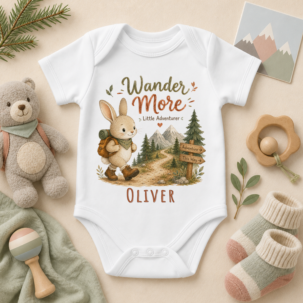 Wander More Little Adventurer personalised watercolour baby bodysuit with bunny and mountains