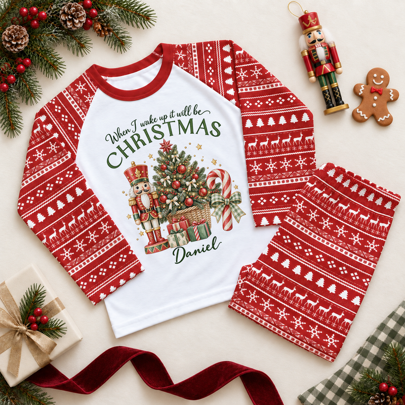 Red and white pyjama set. The print features a nutcracker beside a Christmas tree in a basket, candy canes and wrapped gifts.