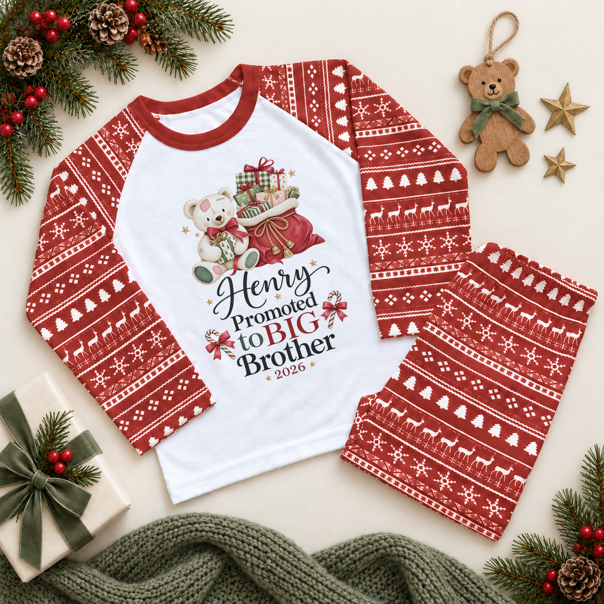 Red and white pyjama set. The print features a teddy holding a gift beside a red sack of presents and Big Brother lettering.