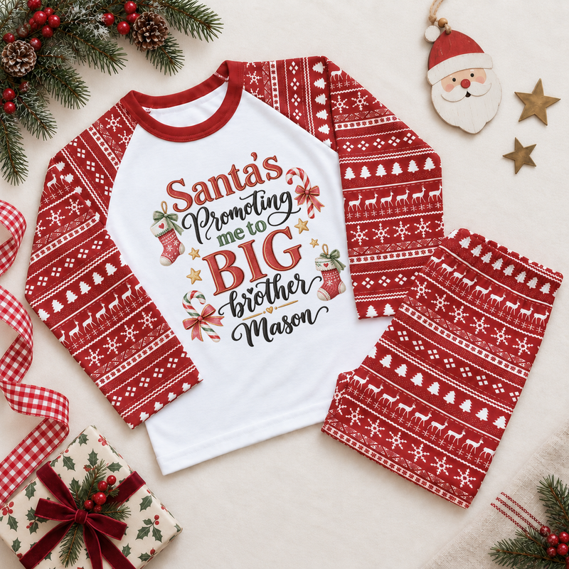 Red and white pyjama set. The print features Big Brother announcement lettering with knitted stockings, candy canes and little stars.