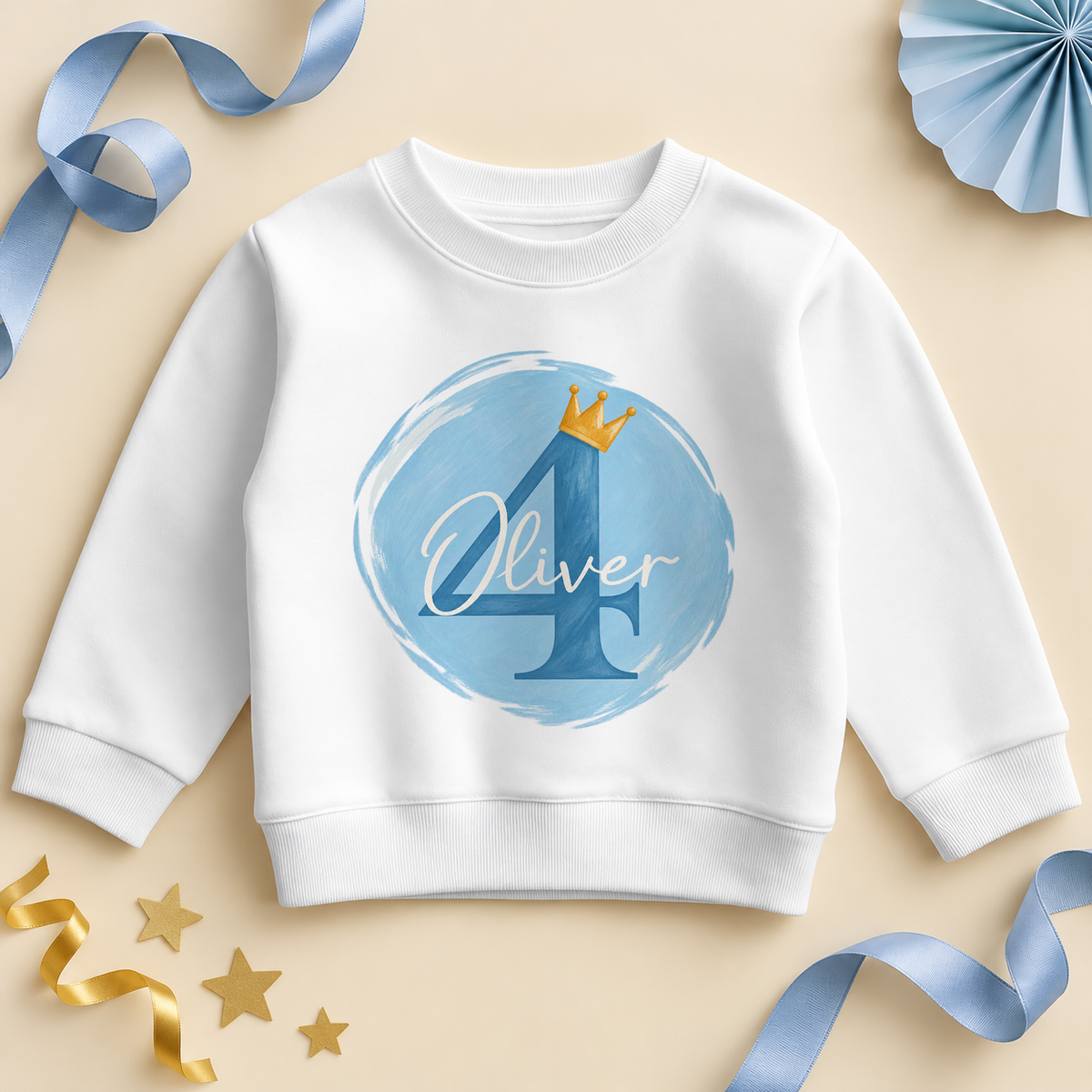White kids sweatshirt printed with a blue number 4 wearing a gold crown on a painted sky blue circle, with an example name in white script across it.