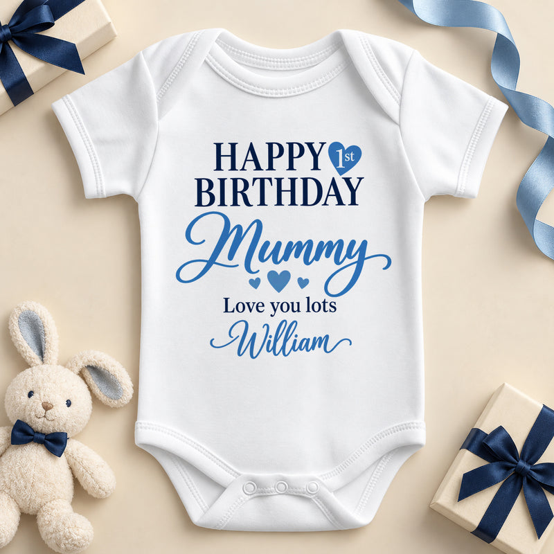 White short sleeve baby bodysuit printed Happy Birthday in navy capitals with 1st inside a blue heart, Mummy in blue script, Love you lots and the example name William.
