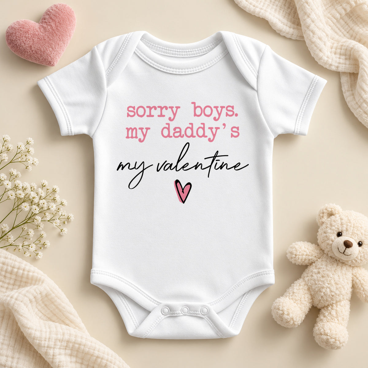 Sorry boys my daddy's my valentine baby bodysuit: a white baby vest with pink typewriter lettering, black script and a small pink heart