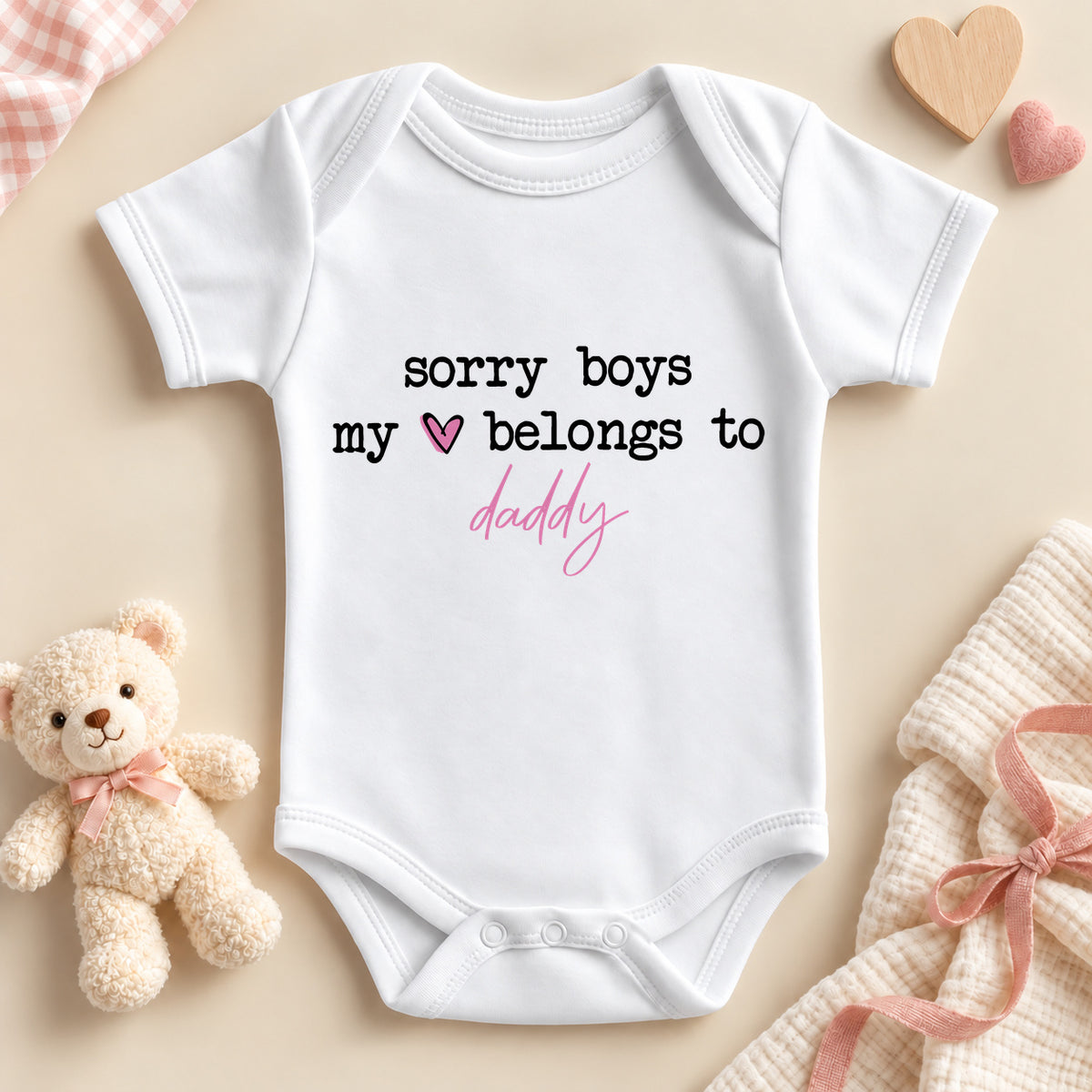 Sorry boys my heart belongs to daddy baby bodysuit: a white baby vest with black typewriter lettering, a pink heart and daddy in pink script
