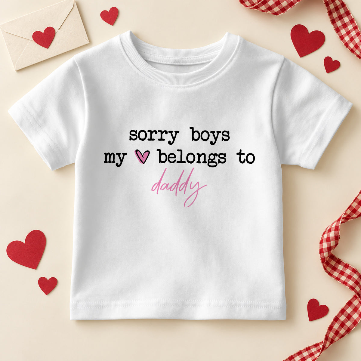 Sorry boys my heart belongs to daddy kids T-shirt: a white tee with black typewriter lettering, a pink heart and daddy in pink script