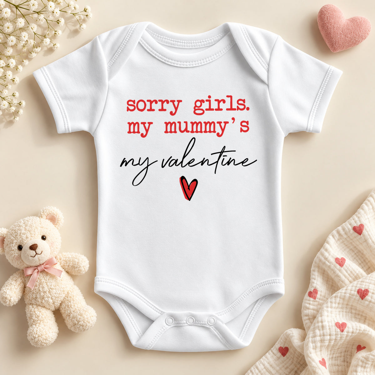 Sorry girls my mummy's my valentine baby bodysuit: a white baby vest with red typewriter lettering, black script and a small red heart